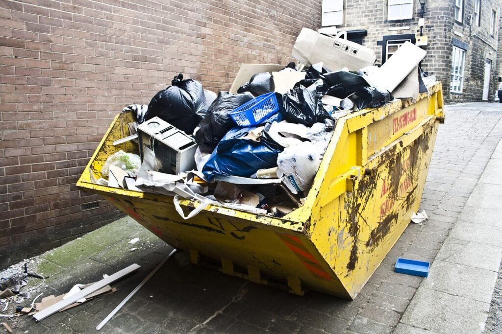 Rubbish skip full of waste on a street