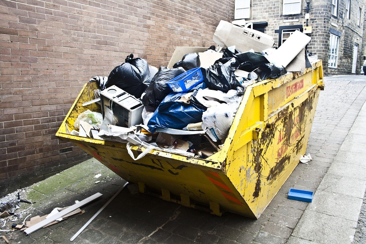 Rubbish skip full of waste on a street