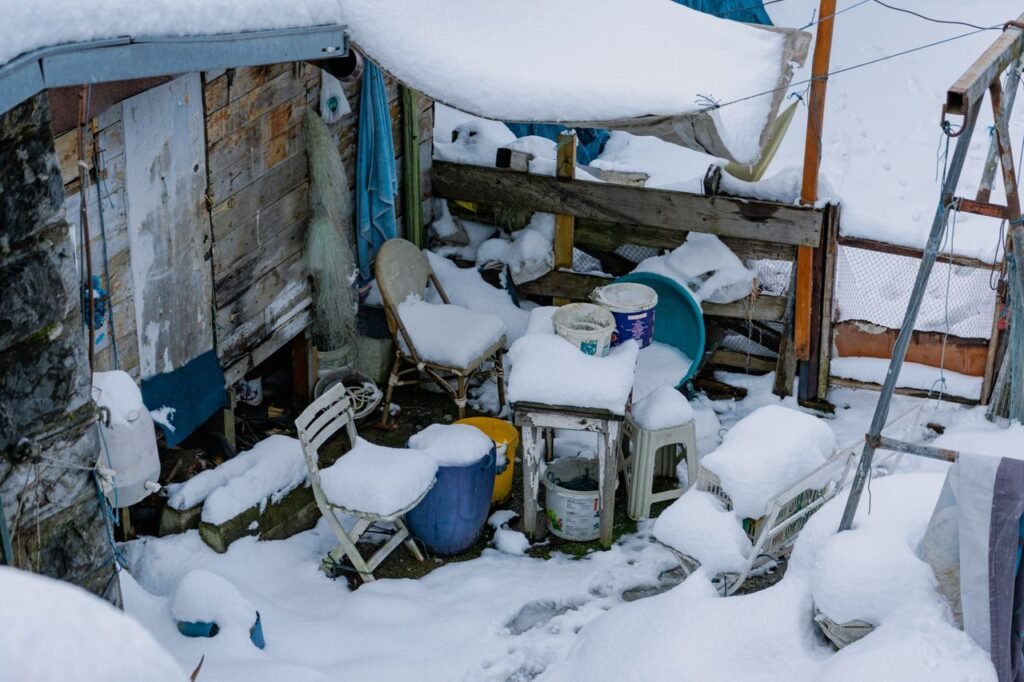 A message garden shed area covered in snow