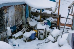 A message garden shed area covered in snow
